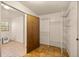 Cozy walk-in closet with door and ventilated shelving at 16891 Ne 243Rd Place Rd, Fort Mc Coy, FL 32134