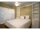 Cozy bedroom with a comfortable bed and built-in storage shelves at 20800 River Dr # A11, Dunnellon, FL 34431
