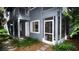 Exterior view of a two-story home with a screened-in patio at 20800 River Dr # A11, Dunnellon, FL 34431