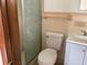 Bathroom showcasing a modern toilet, sink vanity, and tiled shower at 2138 Sw 9Th Rd, Ocala, FL 34471