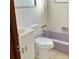 Cozy bathroom featuring a vanity, toilet, and shower with purple tub at 2138 Sw 9Th Rd, Ocala, FL 34471