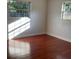 Bedroom featuring hardwood floors, windows, and neutral paint at 2138 Sw 9Th Rd, Ocala, FL 34471