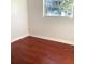 Bedroom featuring hardwood floors, a window, and neutral paint at 2138 Sw 9Th Rd, Ocala, FL 34471