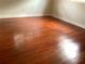 A bright bedroom showcases beautiful hardwood floors and neutral walls, offering a clean and spacious feel at 2138 Sw 9Th Rd, Ocala, FL 34471