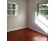 Bright bedroom with two windows and wood flooring at 2138 Sw 9Th Rd, Ocala, FL 34471
