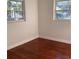 Bedroom featuring hardwood floors, windows, and neutral paint at 2138 Sw 9Th Rd, Ocala, FL 34471