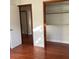 Bedroom with hardwood floors, closet, and neutral paint at 2138 Sw 9Th Rd, Ocala, FL 34471