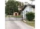 Property exterior with a gated driveway and a storage shed at 2138 Sw 9Th Rd, Ocala, FL 34471