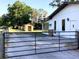Image of home's backyard featuring gated access, storage shed, and exterior view of the home at 2138 Sw 9Th Rd, Ocala, FL 34471