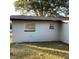 Image featuring block house with window and grass at 2138 Sw 9Th Rd, Ocala, FL 34471