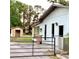 View of backyard featuring gated access, storage shed, and exterior view of the home at 2138 Sw 9Th Rd, Ocala, FL 34471