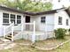 Charming front porch featuring white railings and a classic design, adding curb appeal at 2138 Sw 9Th Rd, Ocala, FL 34471