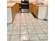 Kitchen featuring wood cabinetry, tile floors, stainless steel range, and laminate counters at 2138 Sw 9Th Rd, Ocala, FL 34471
