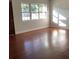 Hardwood floors and natural light fill this spacious living room at 2138 Sw 9Th Rd, Ocala, FL 34471