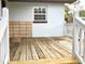 Exterior angle of the wood deck, with visible support beams and white posts at 2138 Sw 9Th Rd, Ocala, FL 34471