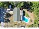 Aerial view of a home featuring a spacious backyard, a pool, and a detached shed at 2808 Ne 24Th Ct, Ocala, FL 34470