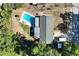 Overhead view of property featuring a pool, well-maintained yard, and detached shed at 2808 Ne 24Th Ct, Ocala, FL 34470