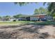 Well-manicured backyard features patio, seating, and kayaks, offering a perfect outdoor retreat at 2808 Ne 24Th Ct, Ocala, FL 34470