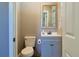 Half bathroom with updated vanity, fixtures, paint and lighting at 2808 Ne 24Th Ct, Ocala, FL 34470