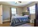 Cozy bedroom with dual windows offering ample natural light and neutral toned walls at 2808 Ne 24Th Ct, Ocala, FL 34470