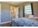 Bedroom view into ensuite bathroom and a sun-filled window perfect for relaxing at 2808 Ne 24Th Ct, Ocala, FL 34470