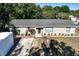 Charming single-story home with a well-maintained lawn, bordered by a line of shrubs at 2808 Ne 24Th Ct, Ocala, FL 34470