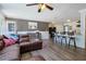 Open-concept living space flows into kitchen, highlighting breakfast bar and contemporary design at 2808 Ne 24Th Ct, Ocala, FL 34470