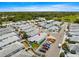A peaceful aerial view showcasing a charming community with well-maintained homes and beautiful landscaping at 3017 Moultrie Way, The Villages, FL 32162