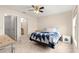 Bedroom featuring neutral color walls, tile floors, ceiling fan, closet and natural light at 3017 Moultrie Way, The Villages, FL 32162