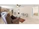 Comfortable living room with tile flooring and a view of the kitchen and dining area at 3017 Moultrie Way, The Villages, FL 32162
