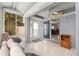 Bright sunroom featuring tile floors, ceiling fan, neutral color walls and lots of natural light at 3017 Moultrie Way, The Villages, FL 32162