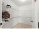 Walk-in closet featuring wire shelving and tile flooring at 3017 Moultrie Way, The Villages, FL 32162