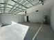 This spacious garage has ample room for vehicles and storage at 4573 Sw Carnation Ct, Dunnellon, FL 34431