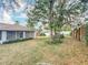 Spacious backyard with mature trees and landscaping at 5327 Sw 89Th St, Ocala, FL 34476