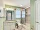 bathroom featuring a shower, toilet, vanity and window at 5327 Sw 89Th St, Ocala, FL 34476