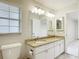 Bathroom featuring a granite countertop, vanity, and window at 5327 Sw 89Th St, Ocala, FL 34476
