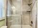 Updated shower featuring a built in shelf and glass door at 5327 Sw 89Th St, Ocala, FL 34476