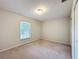Bedroom featuring a window and neutral carpeting at 5327 Sw 89Th St, Ocala, FL 34476
