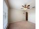 Neutral bedroom features a ceiling fan, window, and carpeting at 5327 Sw 89Th St, Ocala, FL 34476