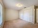Bedroom featuring a double closet and neutral carpeting at 5327 Sw 89Th St, Ocala, FL 34476