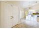 Bright foyer with tiled flooring that transitions to an open floor plan, leading to the kitchen at 5327 Sw 89Th St, Ocala, FL 34476