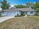 Charming single-story home with a well-maintained lawn and attached two-car garage at 5327 Sw 89Th St, Ocala, FL 34476