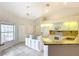 Bright kitchen featuring an island, tile floors, and white appliances at 5327 Sw 89Th St, Ocala, FL 34476