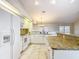 Spacious kitchen with granite countertops, stainless appliances, tile flooring, and white cabinets at 5327 Sw 89Th St, Ocala, FL 34476