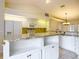 Bright kitchen featuring granite countertops, stainless appliances, white cabinets, and tile flooring at 5327 Sw 89Th St, Ocala, FL 34476