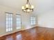 Light-filled living room featuring french doors and hardwood flooring at 5327 Sw 89Th St, Ocala, FL 34476