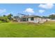 Expansive backyard featuring a screened-in patio and plenty of green space at 5331 Old Hickory Ln, Fruitland Park, FL 34731