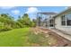 Large backyard featuring a screened-in patio, perfect for outdoor entertaining at 5331 Old Hickory Ln, Fruitland Park, FL 34731