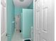 Bathroom showcasing a tiled floor, vanity, and entry door, all in a soothing color scheme at 5331 Old Hickory Ln, Fruitland Park, FL 34731