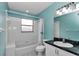 Inviting bathroom with bright turquoise walls, a shower, and ample lighting at 5331 Old Hickory Ln, Fruitland Park, FL 34731